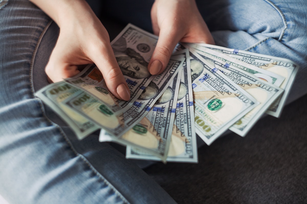 Hands reviewing shift totals and finances a trusted register unlocks